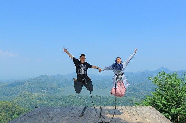 excited couple jumping