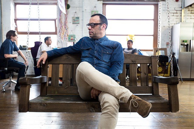 man sitting cross leg